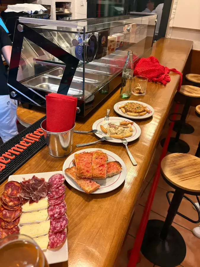 Traditional neighbourhood bar tapas — charcuterie and croquettes in Castelldefels